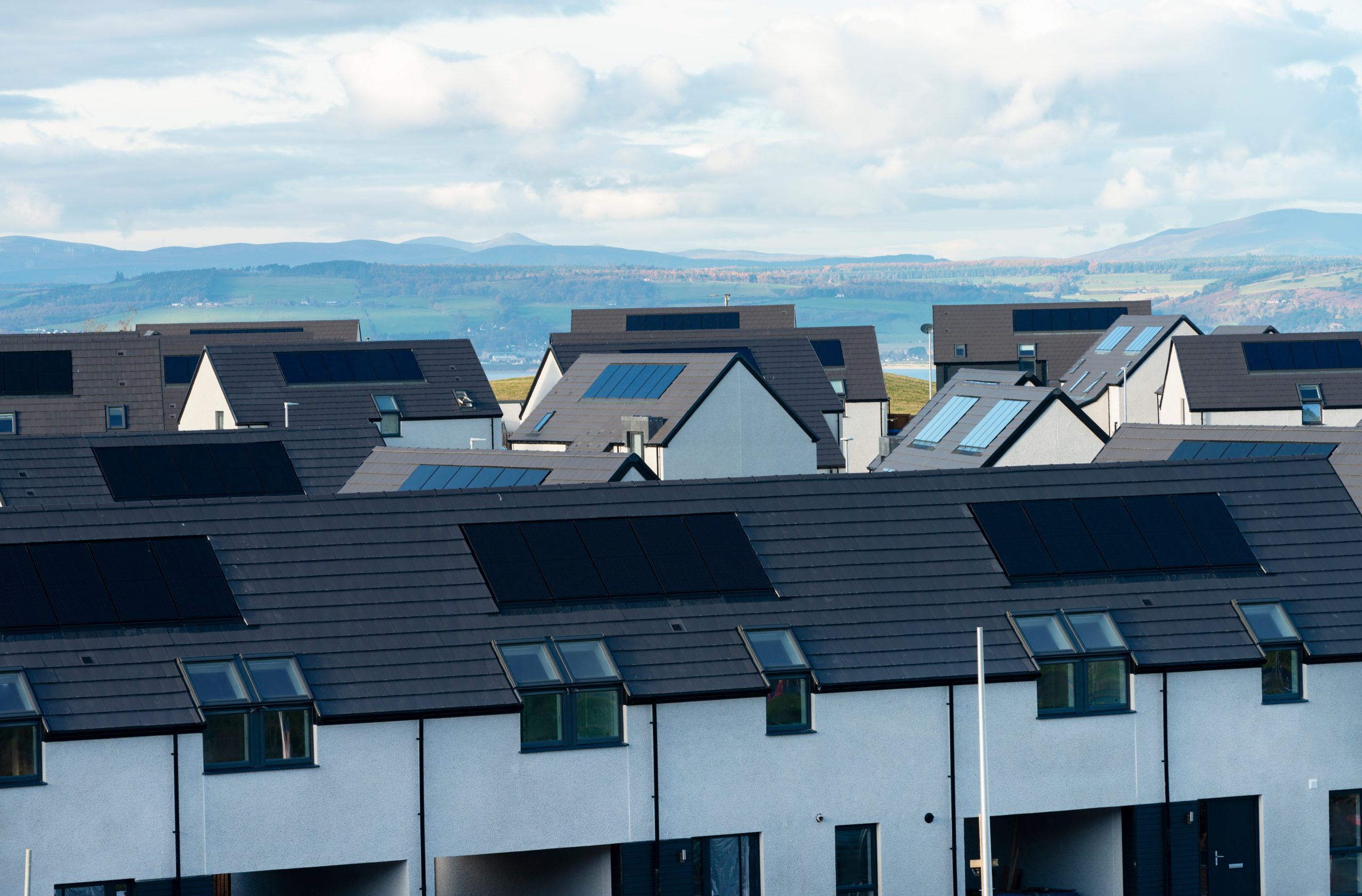 Photograph,Showing,Just,The,Roofs,Of,Houses,With,Photovoltaic,Solar Photograph,Showing,Just,The,Roofs,Of,Houses,With,Photovoltaic,Solar